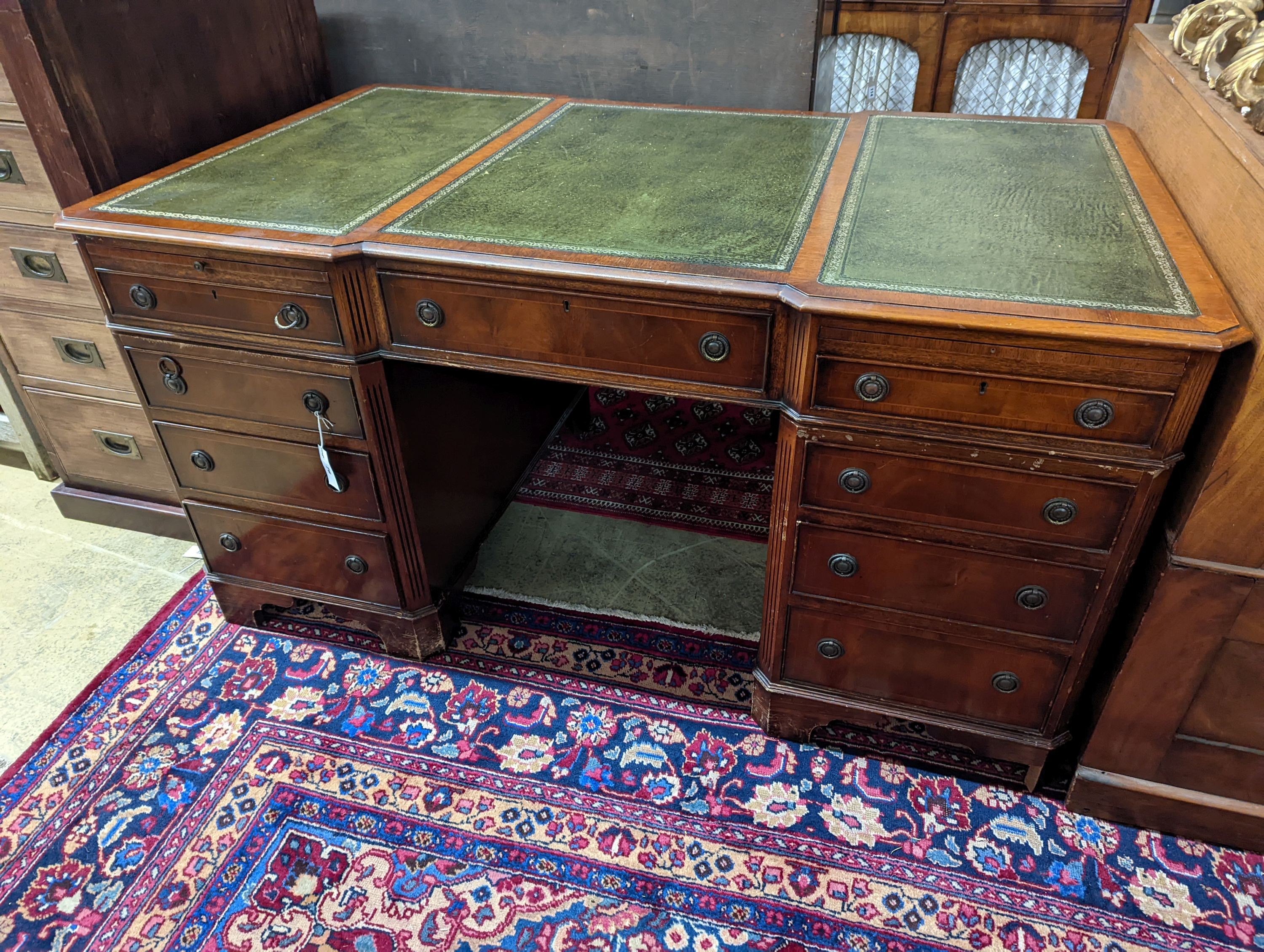 A reproduction George III style mahogany pedestal desk, length 150cm, depth 90cm, height 76cm